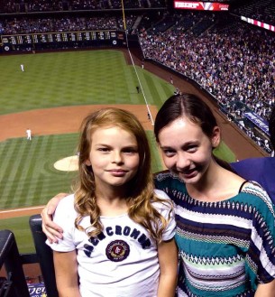 Exchange sisters, Anne Cavard (left) and Raina Miller (right) spent time in each other's country. Here they enjoy the Rockies game in Denver.