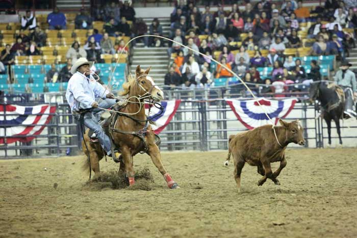 The rodeo features African-American men and women contestants who participate in traditional rodeo events like calf roping and bareback bronc riding. 