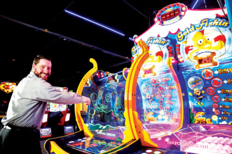 Assistant General Manager Kyle Lockwood plays one of the many games at Gameworks in Northfield.
