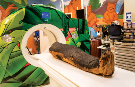 The mummy is pictured next to the Children’s Hospital scanner. 