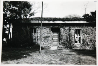 This photo shows the house with the plaster removed during a renovation project.