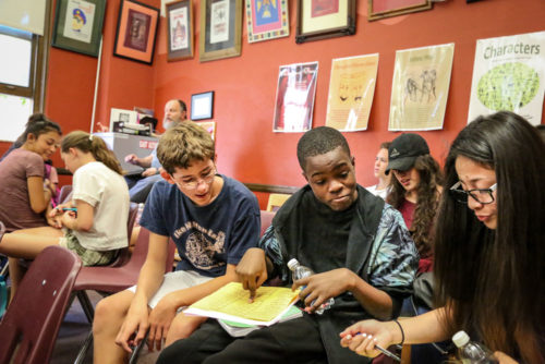 Wyatt Mandear, Navon Powell and Nina Poot from Hill Middle School ponder the schedule at East High 9th Grade Academy.