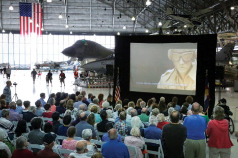  Attendees view a video about the sculptor’s story. 