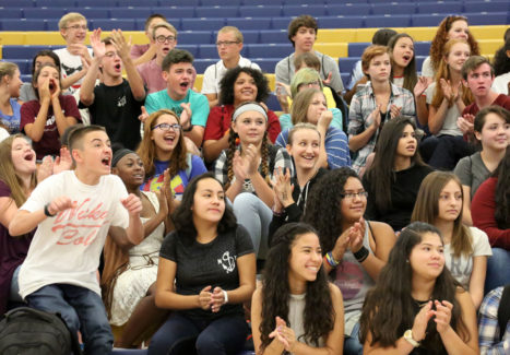 Northfield High School 9th graders cheer as teachers are introduced during the Ninth Grade Academy the week before school started