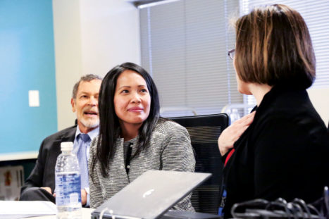 DPS Board Representative Rachele Espiritu (shown at her board swearing in) proposed a unanimously-passed resolution to fully support the program at NHS. Board Representative Mike Johnson is shown behind her. 