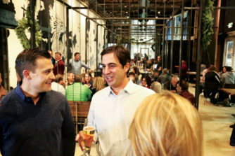  Dustin Skudlarek (left) and Mark Shaker, Stanley Beer Hall partners, enjoy the much-anticipated opening of their beer hall.