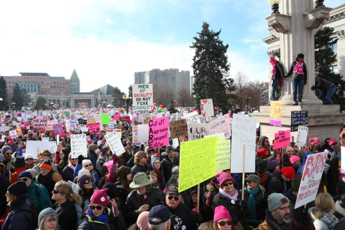 Long before the march started, participants were packed shoulder-to-shoulder, waving signs, chanting, and enjoying being in a crowd of like-minded people.