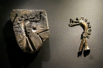 Swedish dress pin, made with reference to the casting mould at left. Dress pins of this kind were usually molded out of silver or gold. Skilled craftspeople creatively used textiles, wood, metal, bone, leather, glass, and ceramics to create pieces for domestic life, ornamentation, and battle.