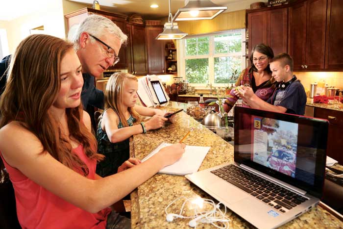 A Stapleton family spending time together while on their devices