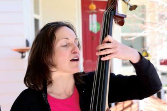 Emily Aronow sings and plays the standup bass.