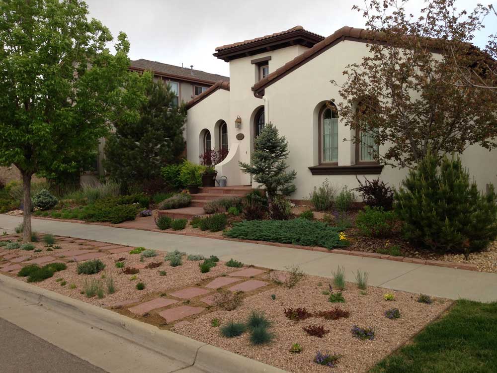 Hardscape materials & plantings were chosen to complement the architecture of this Spanish style home.  Designed by Sarah Christian, RLA.