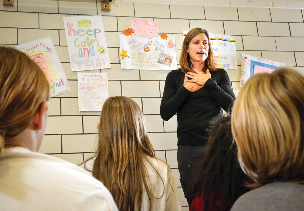 Reproductive health teacher at McAuliffe Kendra Collings teaches a class to seventh-grade girls.
