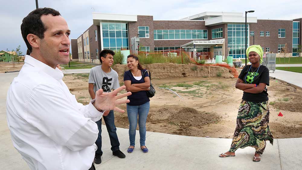 Before school started this fall, then-Principal Avi Tropper talks to students at the new campus.