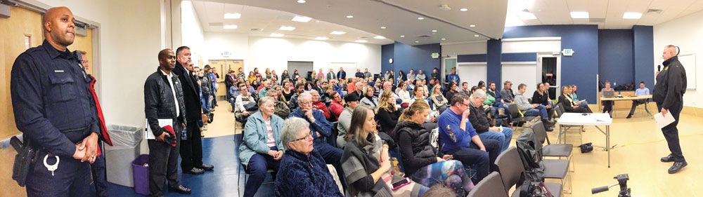 District 5 Lieutenant Bob Wyckoff addresses a crowd of more than 100 that gathered to discuss recent concerns about safety in Stapleton.