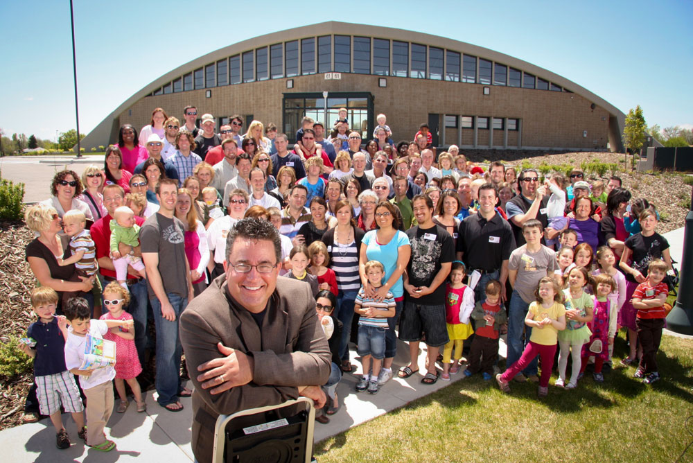 The congregation from Hangar 61 stands outside the building after it was purchased in 2010. 