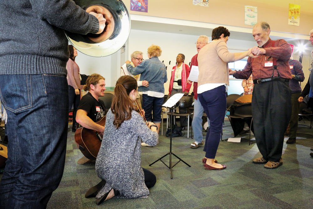 As comfort levels rise among the group, singing and playing music give rise to dancing. Rick Leete is shown dancing with instructor Kera Magarill.