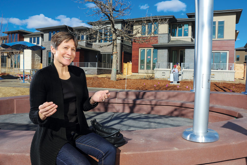 Hilarie Portell, Public Relations Director for the Lowry Redevelopment Authority, describes progress of Boulevard One, Lowry’s last neighborhood to develop. She is seated at the “Urban Kiva”, a public art/gathering place located in the project’s first phase, which consists of single-family detached homes in the northwest quadrant of the site. 