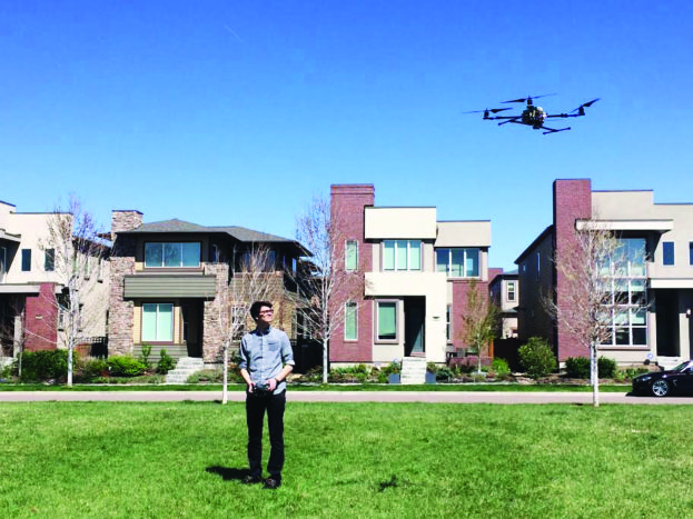 Recent DSST student Nathan Lepore, who helped build a drone for a national park in Rwanda, flies a drone in his Stapleton neighborhood. Photo by Molly Lepore