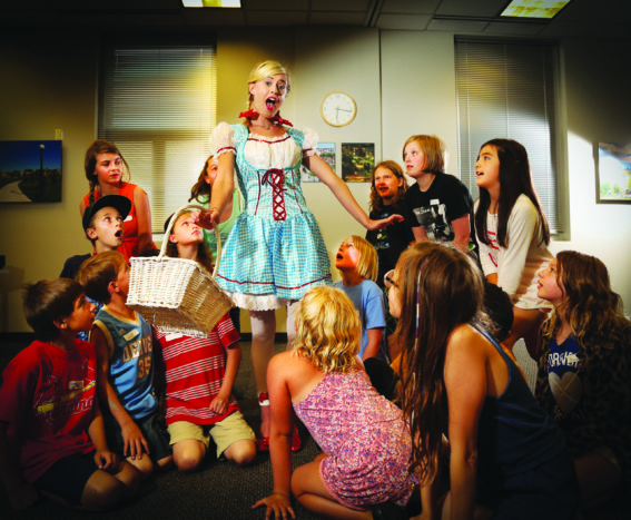 Zelda Rogers, 16, who will play Dorothy, is surrounded by cast members at their first rehearsal.