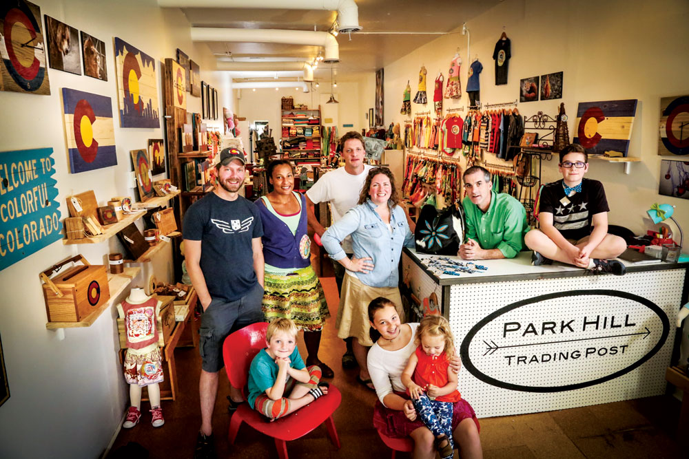 Park Hill Trading Post artisians and their families gather at their shop on Fairfax. Left to right: Jeff Weihing, Park Hill Country; Meridythe Emmanuel, Park Hill Design; Joseph Gabhardt and Jodi McDonough, Colorado Joe’s; Jason Emmanuel, Park Hill Design; Shalom Zohari, Mile High Bow Tie. Front row left to right: Henry, Lily holding Ruby.