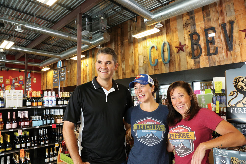 Mike Tilley, Laura Tilley and Stacy Read, the three owners of Colorado Beverage Company in north Stapleton, solicit customers’ suggestions on what products to carry.