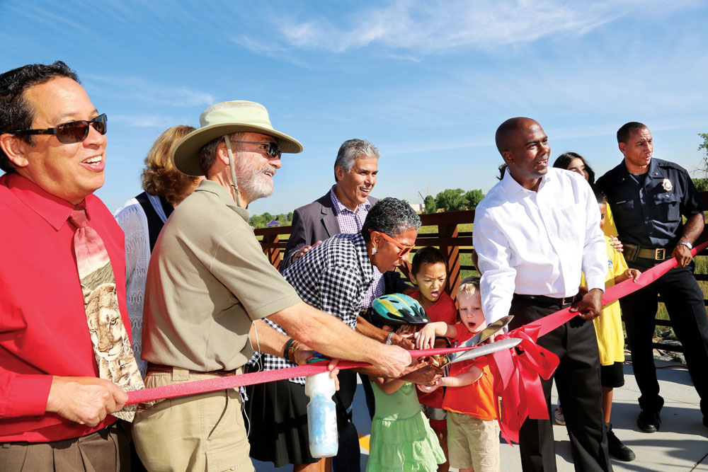 Denver officials and neighbors celebrate the opening of Westerly Creek North open space at a ribbon cutting ceremony on Aug. 17.