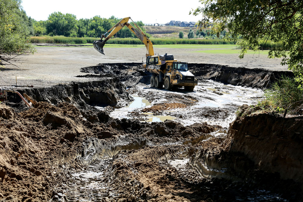 The bottom of Bluff Lake is being excavated and deepened to create a more hospitable nature habitat and lower permeability.