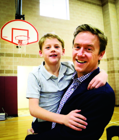 Michael Johnston and his son Emmet, 9, at Bill Roberts School.