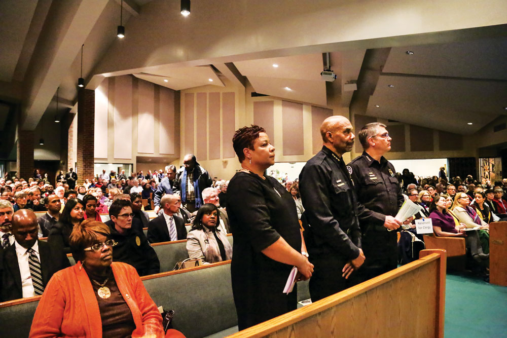 Denver Director of Safety Stephanie O’Malley, Police Chief Robert White, and Sheriff Patrick Firman stand at Shorter AME Church event.