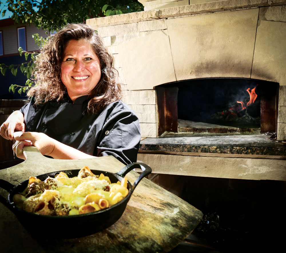 Elise Wiggens has been cooking in her own wood-fired oven at her Stapleton home while waiting for the completion of her new restaurant, Cattivella, expected in mid-April.