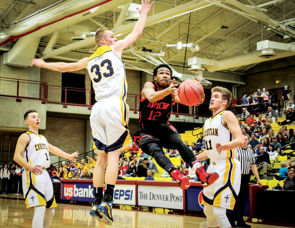 Michael Brooks drives to the hoop against the Colorado Springs Christian School’s Lions. 