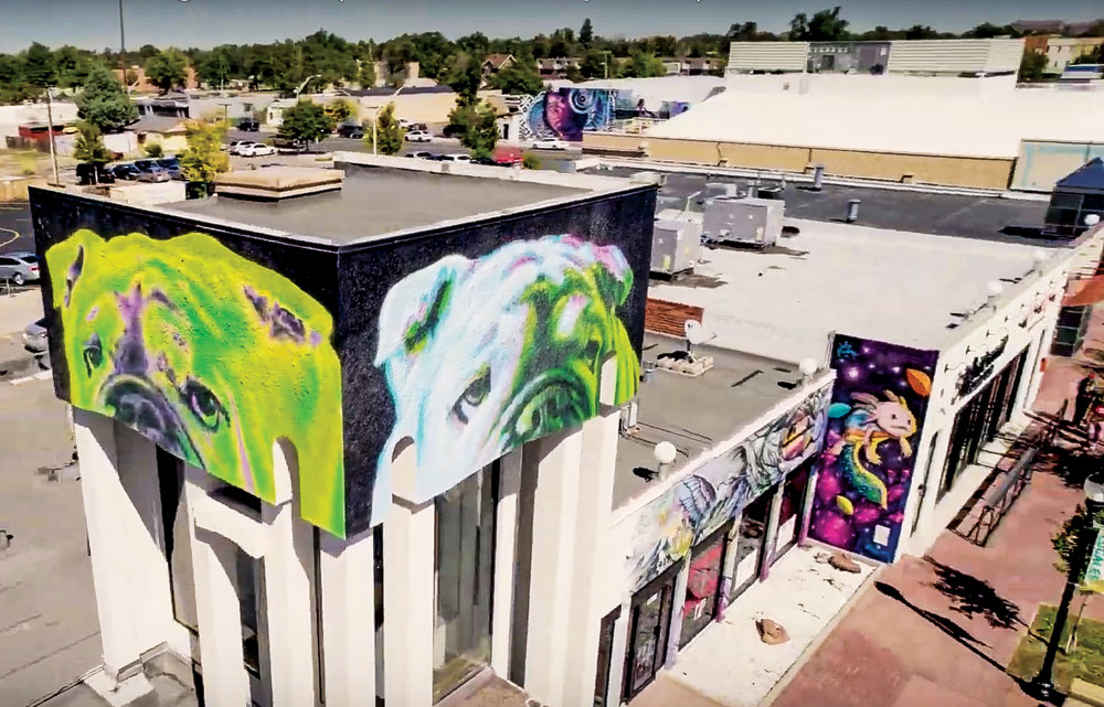 A drone view of East Colfax Ave. shows several murals that have been completed in the region over the past four years.